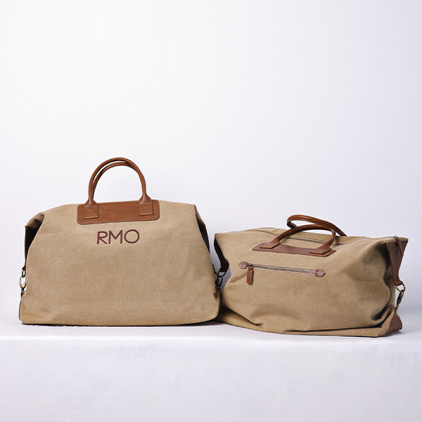 LARGE KHAKI DUFFLE BAG WITH SHOULDER STRAP - BROWN STRAP 83x18x45cm - 83x18x45cm حقيبة يد كبيرة باللون الكاكي مع حزام كتف - حزام بني