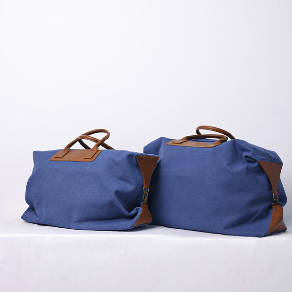 MEDIUM NAVY BLUE DUFFLE BAG WITH SHOULDER STRAP - BROWN STRAP 78x15x39cm - 78x15x39cm حقيبة يد متوسطة الحجم باللون الأزرق الداكن مع حزام كتف- حزام بني