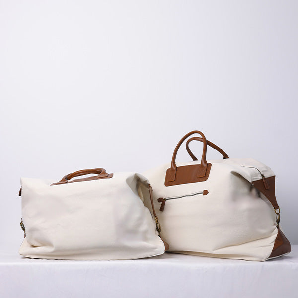 MEDIUM OFF WHITE DUFFLE BAG WITH SHOULDER STRAP  - BROWN STRAP 78x15x39cm - 78x15x39cm حقيبة يد متوسطة الحجم باللون الأبيض مع حزام كتف - حزام بني