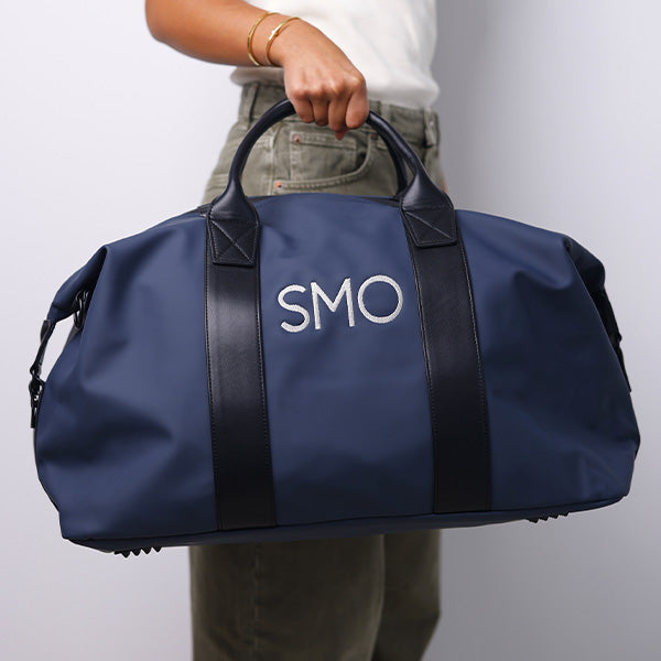 MEDIUM BLACK DUFFLE BAG -  69x26.5x29cm - 69x26.5x29cm حقيبة كتف متوسطة الحجم باللون الأسود